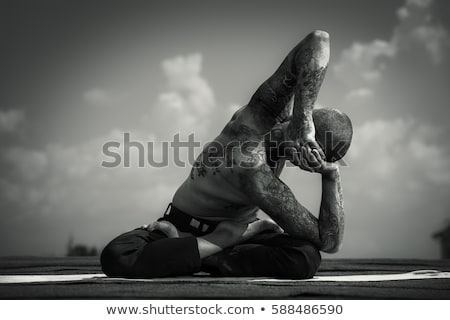 Stock fotó: Man Meditating Outdoors Over Sky