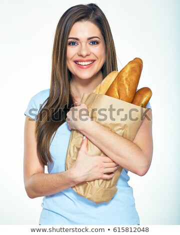 [[stock_photo]]: Portrait Of A Woman Holding Bread Loaf