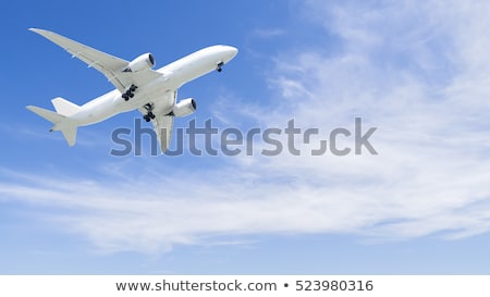 Stockfoto: Passenger Airliner Flying In The Clouds