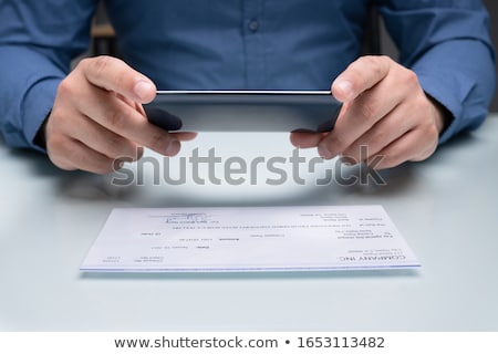 Foto stock: Scanning Remote Deposit Check Document Using Phone