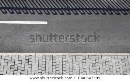 Zdjęcia stock: Sidewalk With Road And Shadow Of Fence