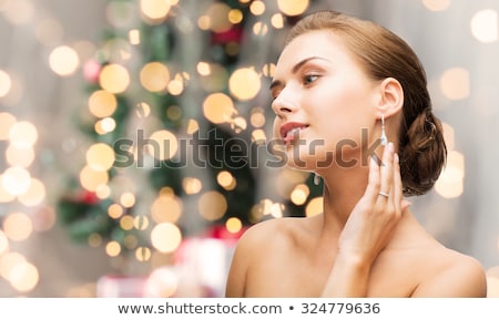 Foto stock: Christmas Woman Showing Advert