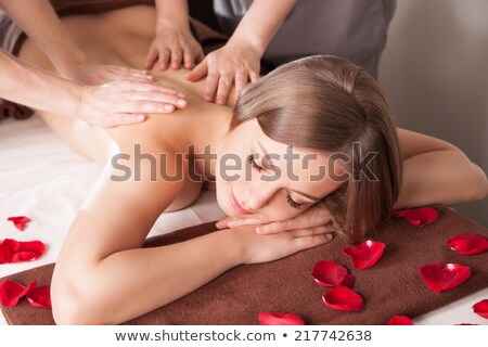 Woman Having Exotic Back Massage Zdjęcia stock © Julenochek