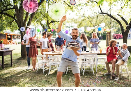 Сток-фото: Woman Holding A Birthday Cake Outdoors