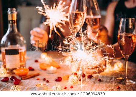 Stok fotoğraf: Friends Celebrating Christmas And Drinking Wine