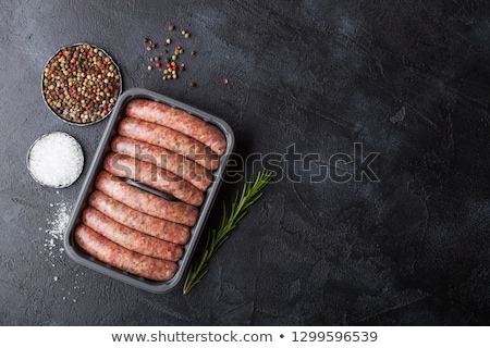 Stock fotó: Raw Beef And Pork Sausage In Plastic Tray With Vintage Knife And Fork On Black Backgroundsalt And P