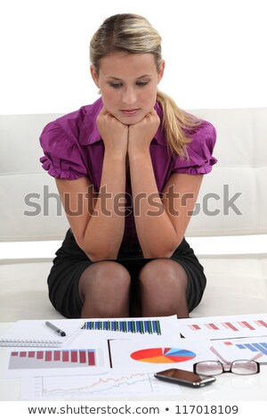 Foto stock: Market Researcher Staring At The Results Of Her Research