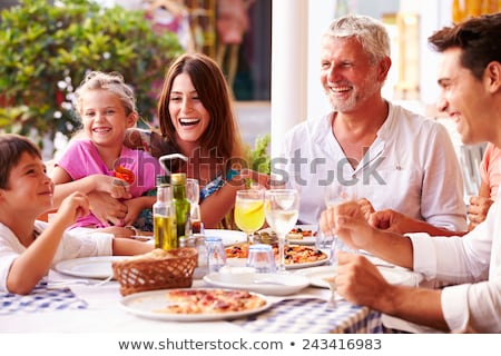 Stockfoto: Mother And Daughter Eating Outdoors