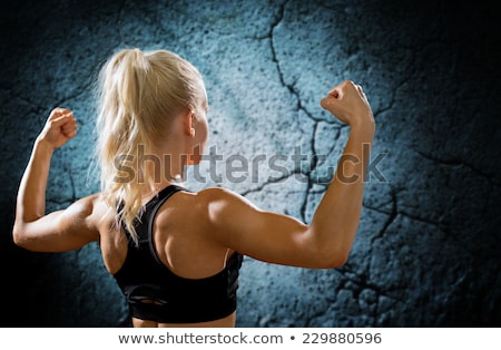 Foto stock: Athletic Young Woman Showing Muscles Of The Back