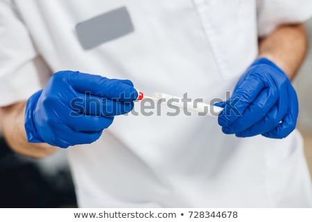 Stockfoto: Female Laboratory Specialist Holding Test Tube With Cotton Swab