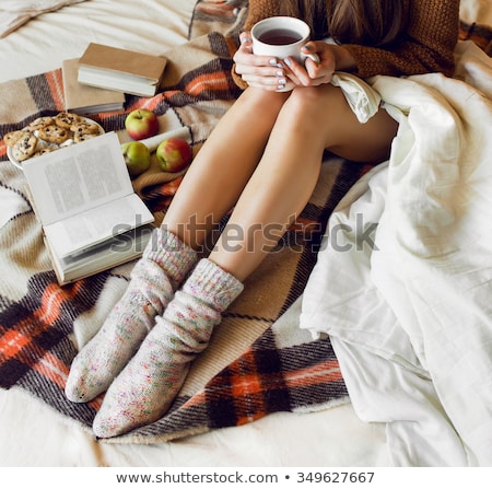 Stok fotoğraf: Woman Holding Hot Cup Of Tea With Cookies