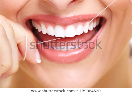 Stock foto: Woman With Dental Floss