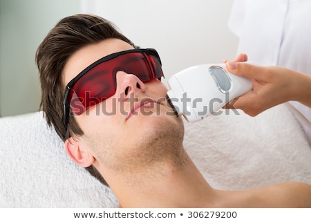 Foto stock: Man Receiving Laser Epilation Treatment