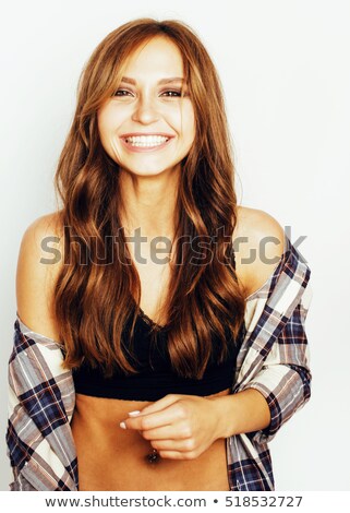 Stockfoto: Studio Portrait Of Stylish Pretty Brunette Girl In Trendy Clothes Gesturing Horns By Hands On Her He