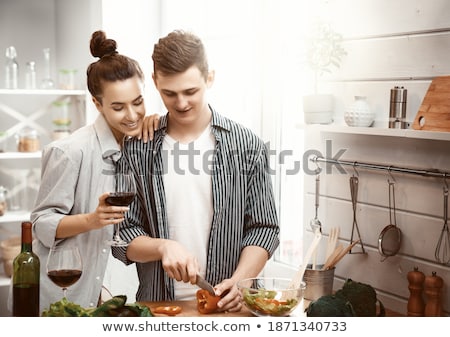 Stockfoto: Loving Couple Is Preparing The Proper Meal