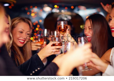 Сток-фото: Happy Women Clinking Glasses At Night Club