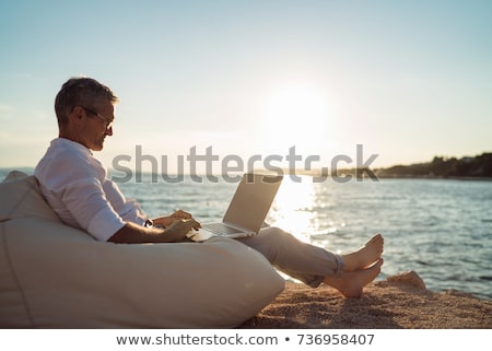 Stockfoto: Man Working On The Beach