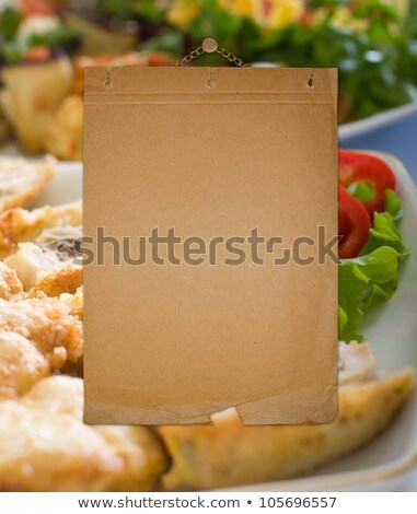 Foto stock: Old Alienated Paper On The Wall For A List Of Restaurant Menu