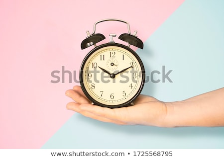 Foto d'archivio: Woman Holding Alarm Clock