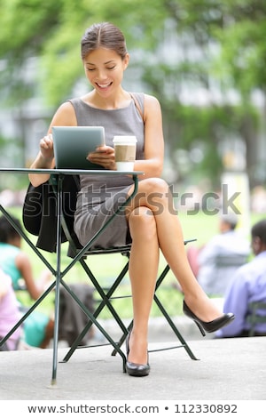 Smiling Businesswoman Holding A Coffee On A Tablet Pc Stock foto © Maridav