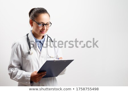 Stock fotó: Doctor Looking At Clipboard