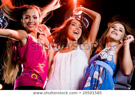 Stock photo: Three Smiling Women Dancing In The Club