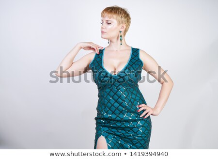 Foto stock: Blond Hair Girl In Sparkling Green Dress Isolated On White