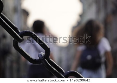 Stock foto: Young Prisoner In Chains Against Gray