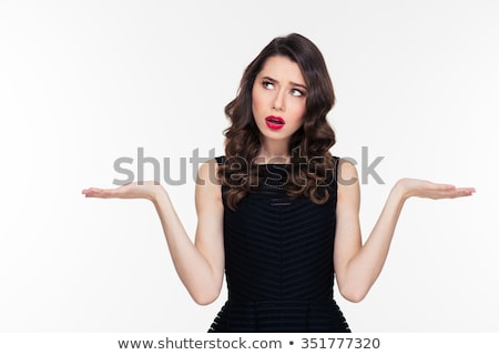 Foto stock: Confused Thoughtful Young Woman Holding Copyspace On Both Palms