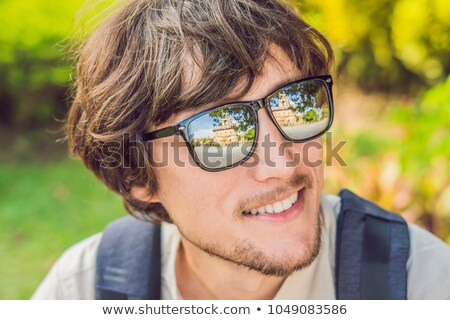 Foto stock: Male Tourist Looking At Wat Chalong Is The Most Important Temple Of Phuket