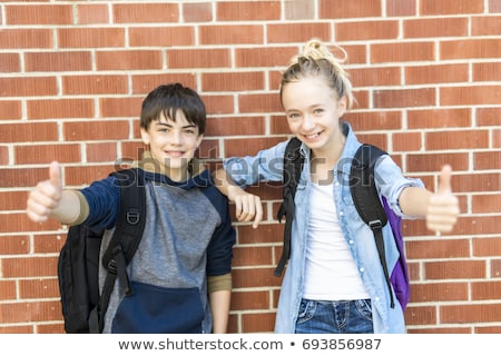 Stock fotó: Portrait Of School 10 Years Boy And Girl Having Fun Outside