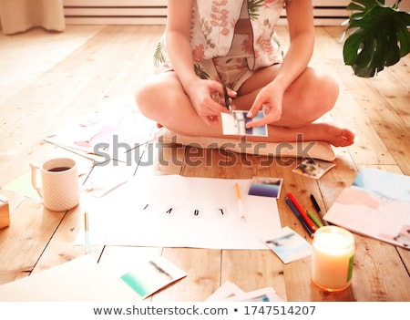 Сток-фото: Young Brunette Woman Creating Her Feng Shui Wish Map