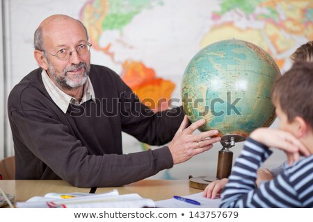 [[stock_photo]]: Three Students In Geography Class