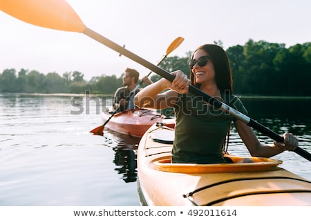 Stock foto: Young Couple In A Canoe