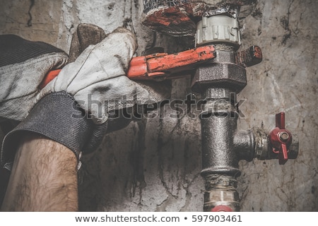 [[stock_photo]]: Craftsman Fixing A Pipe