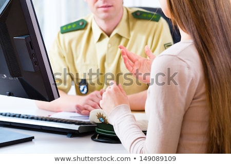 Сток-фото: Police Officer In Department Registering Complaint