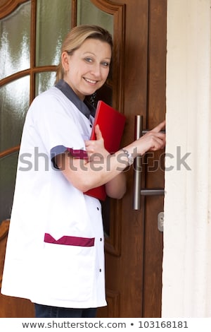 ストックフォト: Female Hand Is Knocking On Doctor Door