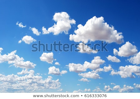 Foto stock: Fluffy Clouds In The Blue Sky