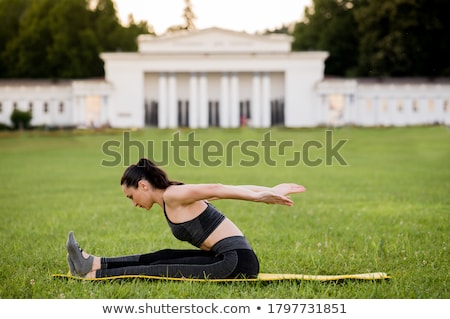 Foto stock: Pilates Woman Boomerang Exercise Workout At Gym