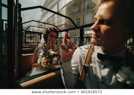 Сток-фото: Bride And Groom Posing In A Tour Car