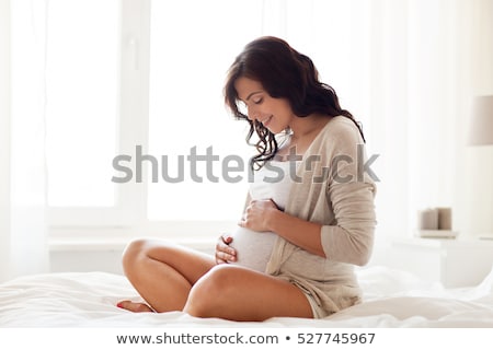 ストックフォト: Pregnant Woman Sitting In Bed