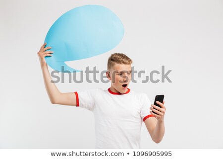 ストックフォト: Photo Of Surprised Hipster Boy Holding Blank Thought Bubble Abov
