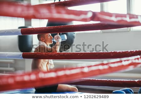 Foto stock: Fighter Drinking From A Bottle Of Water