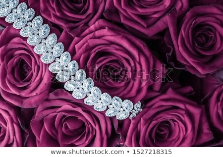 Foto stock: Luxury Diamond Jewelry Bracelet And Pink Roses Flowers Love Gif