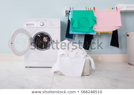 ストックフォト: Woman Using Washing Machine Appliance
