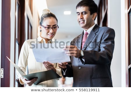 Businessman Discussing Deal With Secretary Foto d'archivio © Kzenon