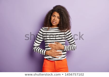 Foto stock: Unhappy Woman Suffering From Stomach Ache