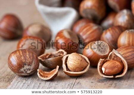 Stock foto: Hazelnut Heap On Wooden Table Selective Focus