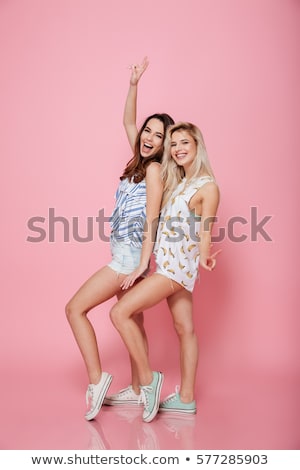 Сток-фото: Two Pretty Young Girls Friends Standing