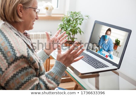 Stockfoto: Young Female Doctor Seeing Woman Patient